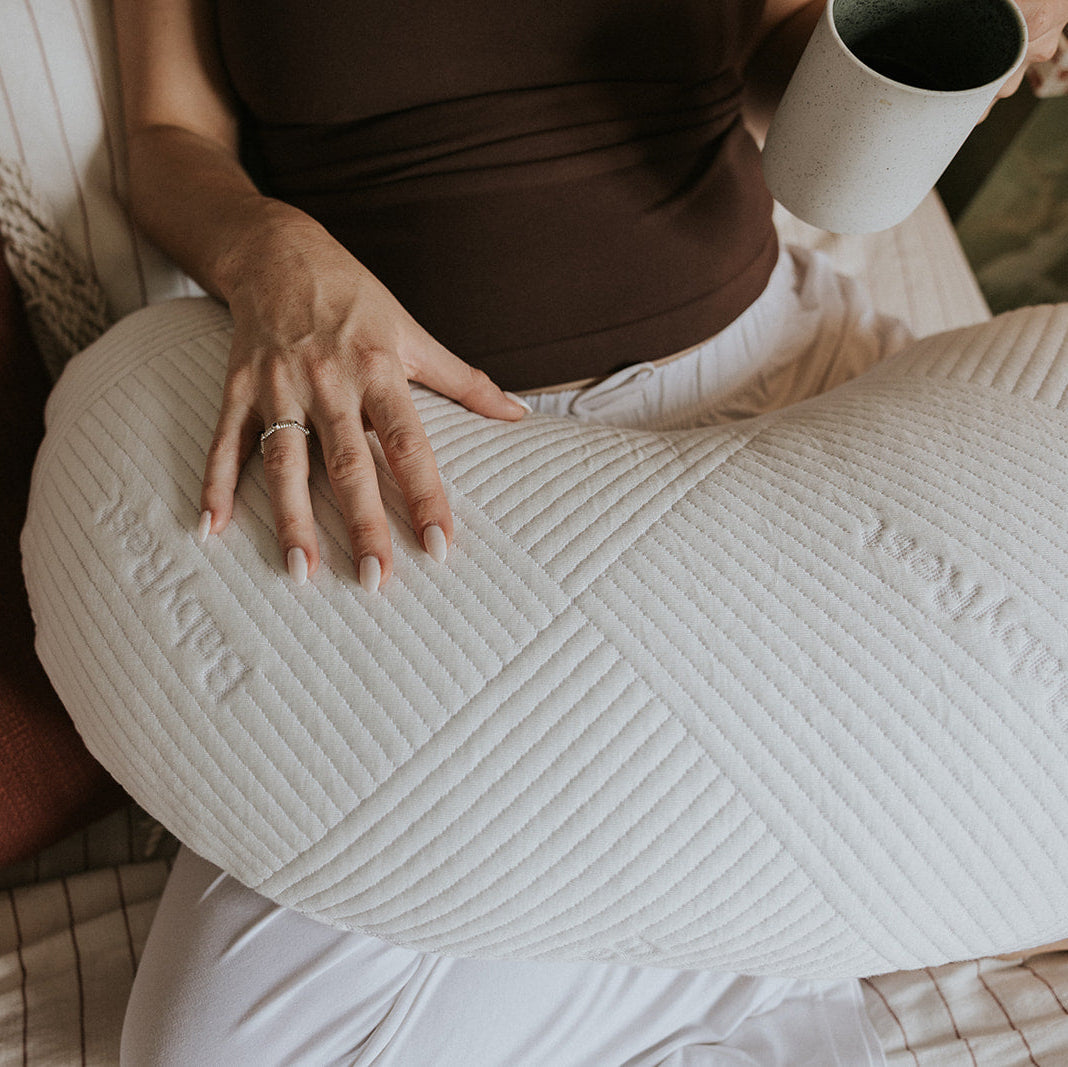 A close up photo of the BabyRest Haven Maternity Support Pillow showing the iconic BabyRest safe sleep surface detailing