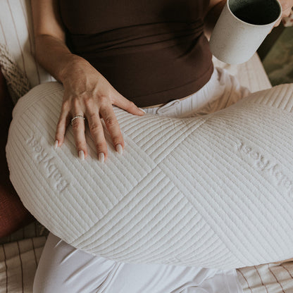 A close up photo of the BabyRest Haven Maternity Support Pillow showing the iconic BabyRest safe sleep surface detailing