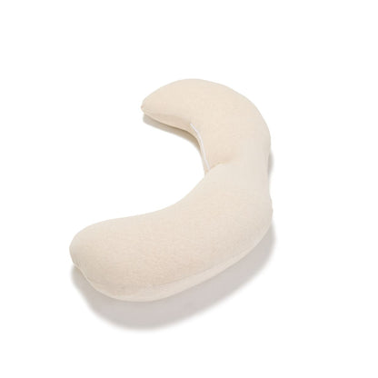 A curved, U-shaped baby nursing pillow in a soft cream or off-white fabric, shown on a clean white background with a soft shadow.